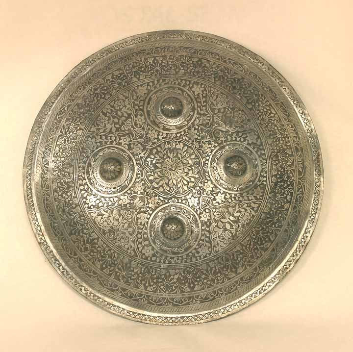 Round shield with floral design