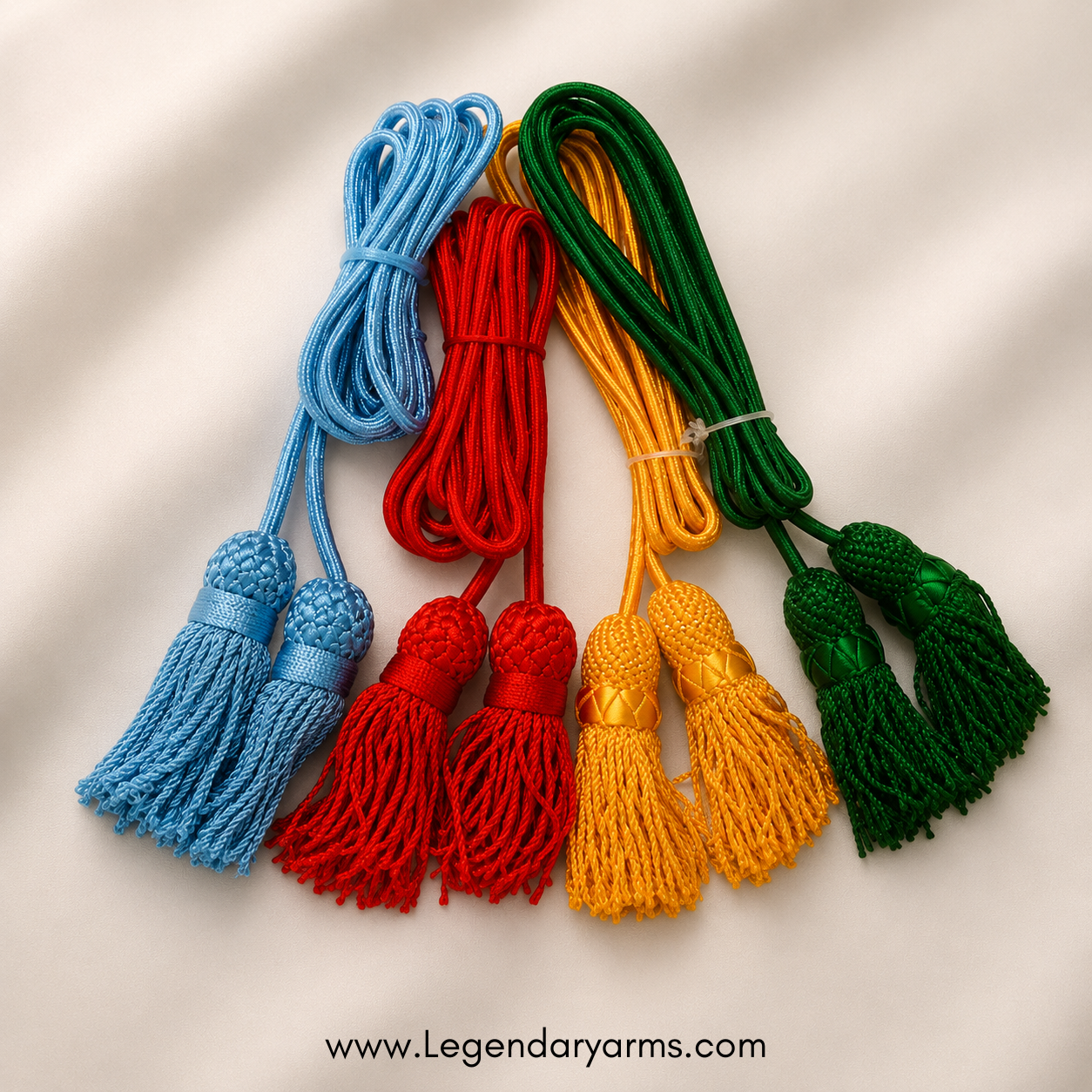 Hand-braided red Civil War bugle cord with decorative tassels shown in close-up.